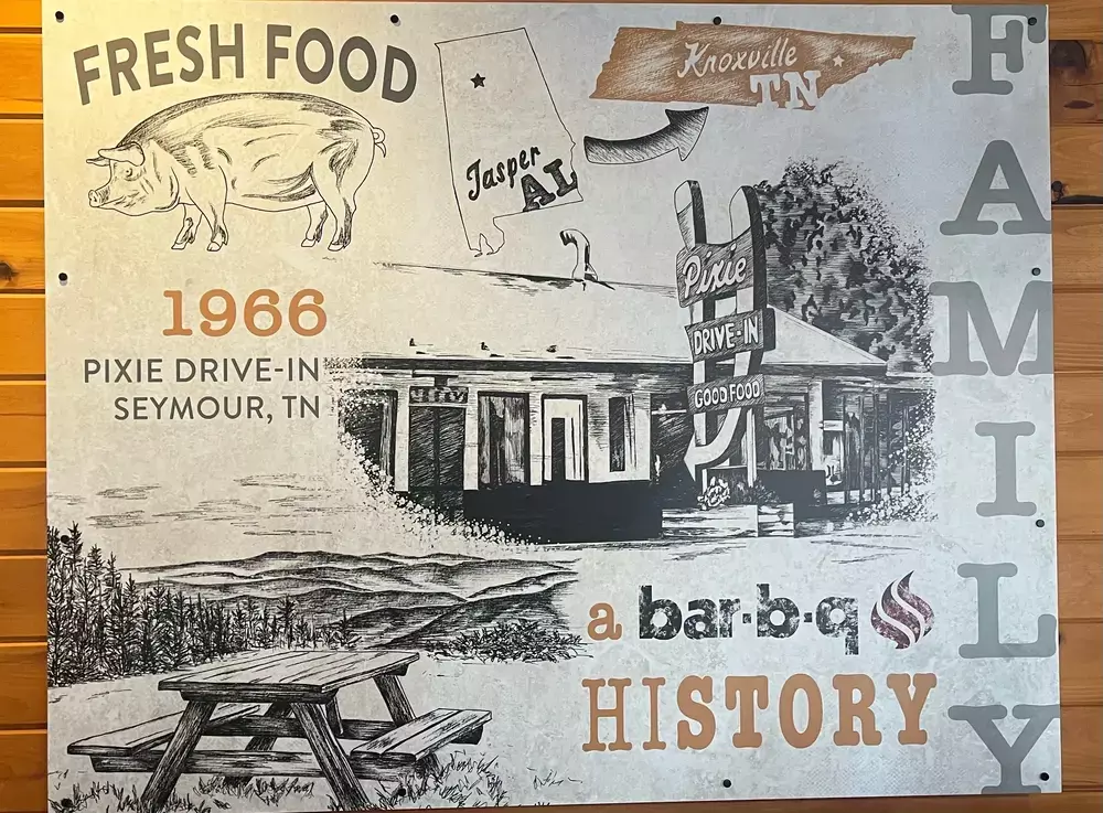 sign illustrating history of Buddy's bar-b-q starting at Pixie Drive-In